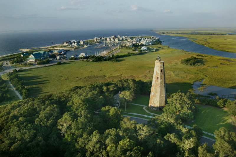 Aerial view of Old Baldy lighthouse and Bald Head Island coastline, North Carolina